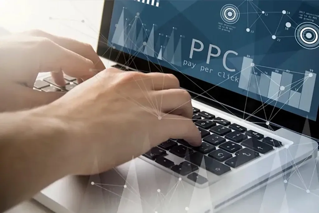 Laptop and notes used for pay-per-click campaign planning