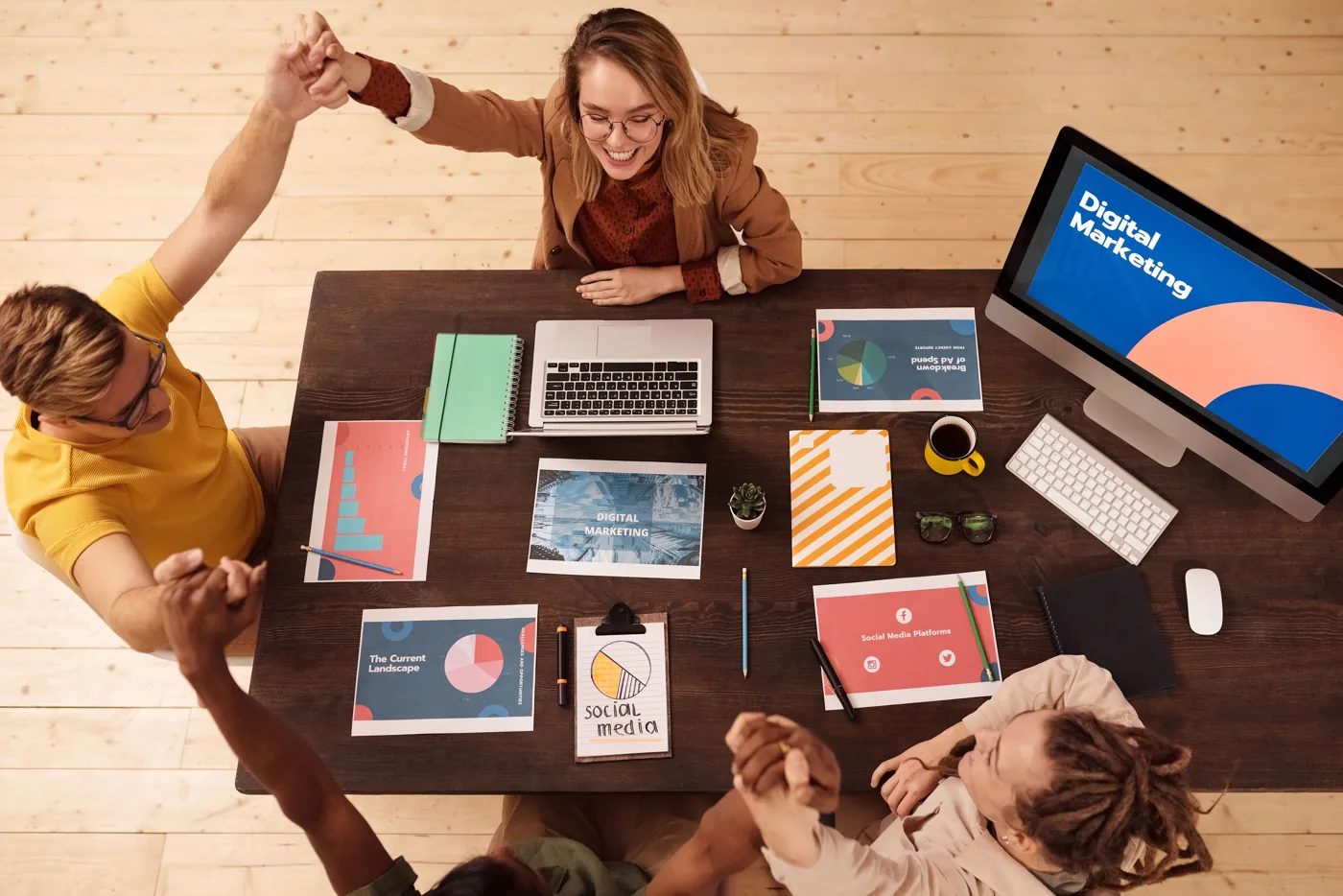 Marketing colleagues collaborating at a long work table